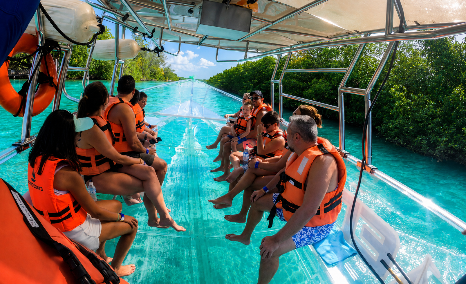 Guests inside clear boat heading out in Turks and Caicos